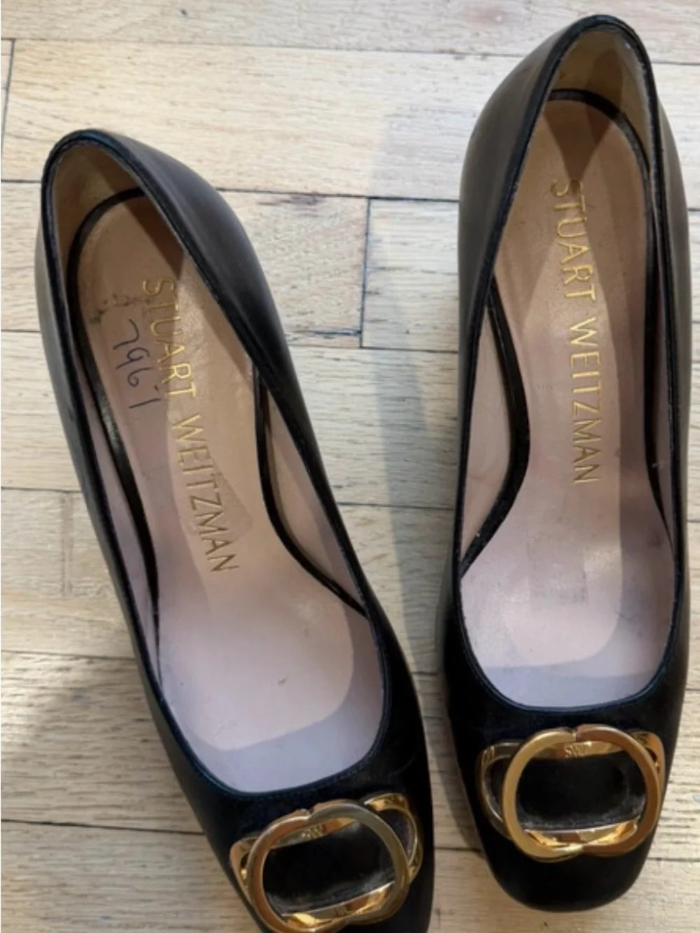 Stuart Weitzman Black Leather Pumps with Gold Buckle Accent